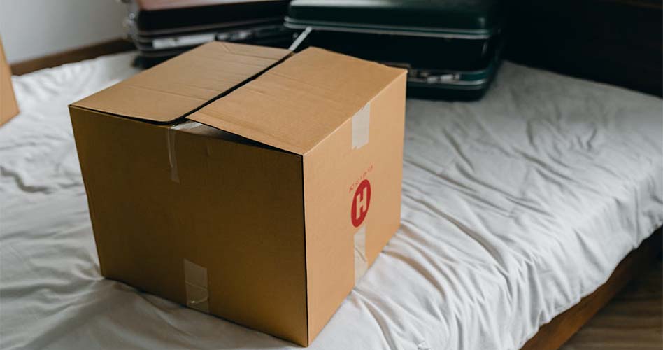 A cardboard box with a red logo.